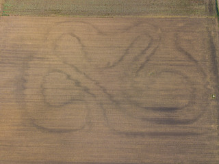 Fototapeta premium Aerial view of plowed fields in rural landscape in Switzerland