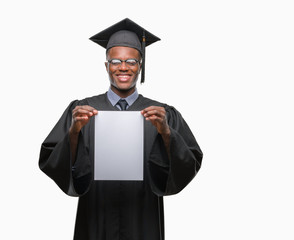 Young graduated african american man holding blank paper degree over isolated background with a happy face standing and smiling with a confident smile showing teeth