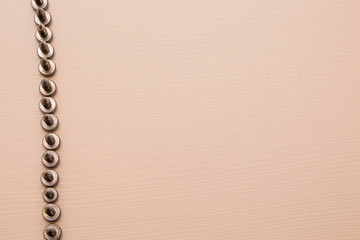 Self-tapping screw on a wooden background 