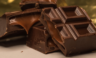 Pieces of chocolate bar filled with chocolate cream