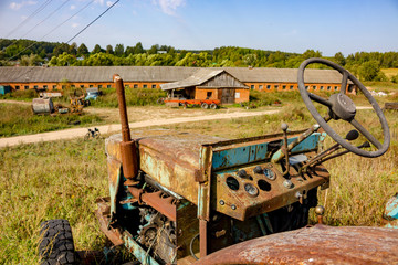 Fototapeta na wymiar Malomakhovo, Russia - September 2018: Old Soviet tractor - Farm in the countryside