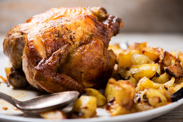 Roasted chicken with vegetables on a plate