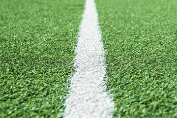 Line that extends from the center into the distance on an artificial football field