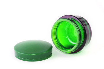 Empty glass can for cream isolated on white background