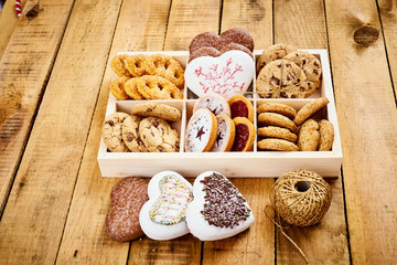 delicious Christmas Eve cookies in a box on an old wooden table