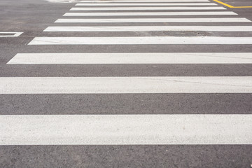 Road marking pedestrian crossing close-up. Pedestrian crossing on asphalt