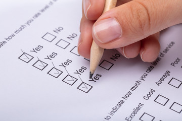 Woman Ticking Yes Choice On Review Form