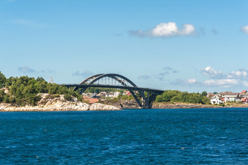 Obraz premium Norway, Stavanger region, Hogsfjorden. Hogsfiord. Bridge from Solyst to Engoy Island. On a cruise to Lysefjord, Lysefiord. Leaving Stavanger behind. Rogaland, Ryfylke scenic route.