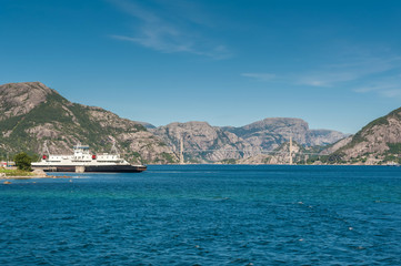 Fototapeta premium Ferry crossing from Lauvvik to Oanes. Norway, Stavanger region, Hogsfjorden. Hogsfiord. On a cruise to Lysefjord, Lysefiord. Rogaland, Ryfylke scenic route.