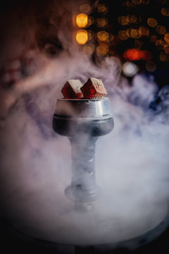 coals of hookah in the smoke