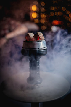 coals of hookah in the smoke