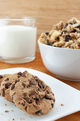 Chocolate cookie and muesli on wooden table