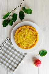 Apple pie Charlotte on a white wooden table
