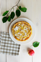Apple pie Charlotte on a white wooden table