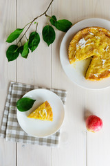 Apple pie Charlotte on a white wooden table