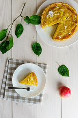 Apple pie Charlotte on a white wooden table