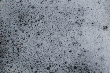 White foam on dark background