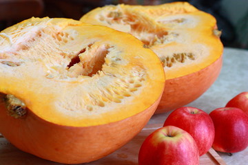 Sliced ​​ripe pumpkin on the kitchen table