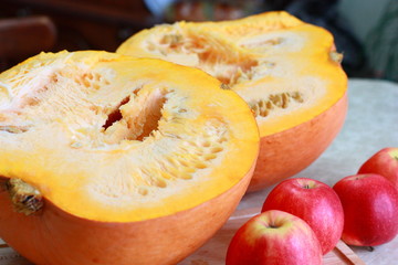 Sliced ​​ripe pumpkin on the kitchen table