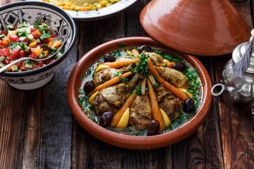 Chicken tajine with couscous, moroccan food, close view.