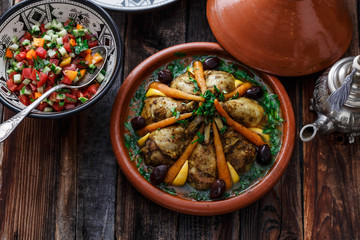 Chicken tajine with couscous, moroccan food, close view.