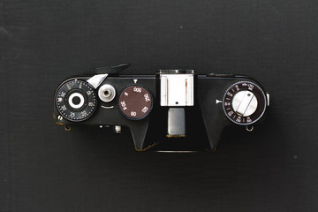 old camera film on a textured background / outdated model just gathering dust on the shelf