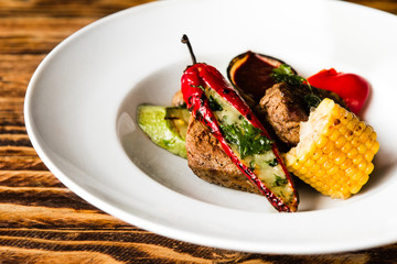 chic delicious steak with vegetable garnish