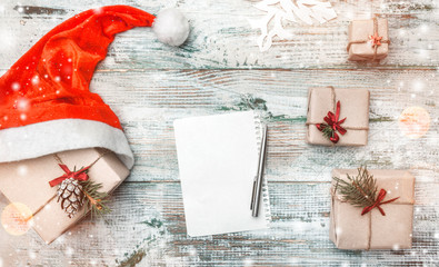 Winter background, Santa's gifts, and letter for wishes and greeting cards for loved ones in...