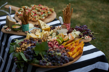 Party table at the garden. Table Food Lunch Variety Outdoors decorations 