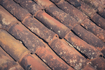 old roof tiles closeup - vintage ceramic roofing