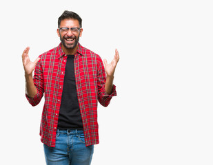 Adult hispanic man wearing glasses over isolated background celebrating mad and crazy for success...