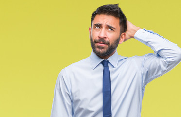 Adult hispanic business man over isolated background confuse and wonder about question. Uncertain with doubt, thinking with hand on head. Pensive concept.