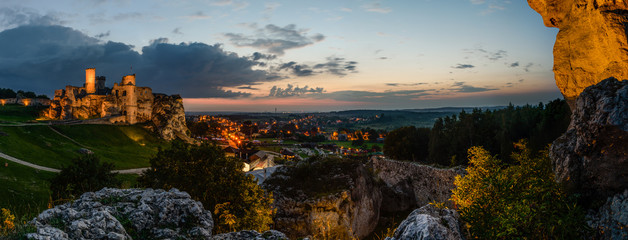 Night panorama with Ruins of medieval castle Ogrodzieniec Castle Podzamcze Poland. The castle is situated on the 515.5 m high Castle Mountain built in the 14th century .