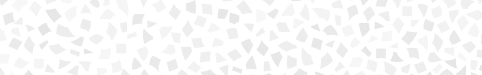 Abstract banner of small gray pieces of paper or splinters of ceramics on white background