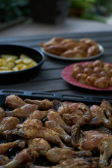 Grilled chicken drumsticks background, close-up. Roasted chicken legs, Cooked with sauce