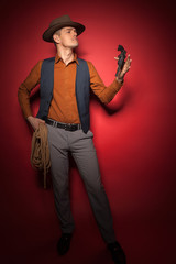 cowboy with a pistol, a gold miner adventure guy in a hat with a gun,