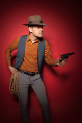 cowboy with a pistol, a gold miner adventure guy in a hat with a gun,