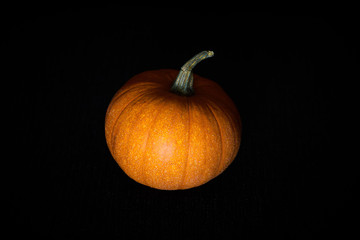 Pumpkin in darkness. Halloween mood. 