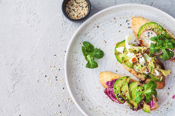 bruschetta with lettuce, vegetables and cheese