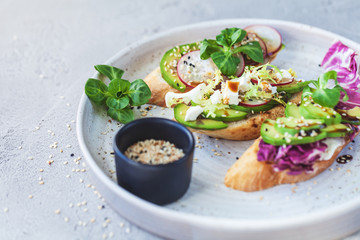 bruschetta with lettuce, vegetables and cheese