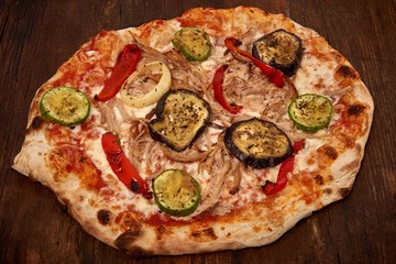 Homemade fresh delicious gourmet pizza,Tasty italian pizza isolated on wooden table, closeup