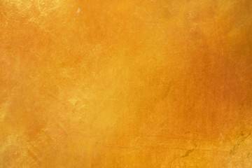 Obraz na płótnie Canvas abtract grunge surface orange gold background golden yellow highlights