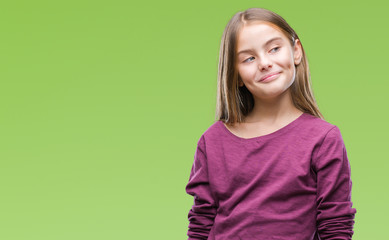 Young beautiful girl over isolated background smiling looking side and staring away thinking.