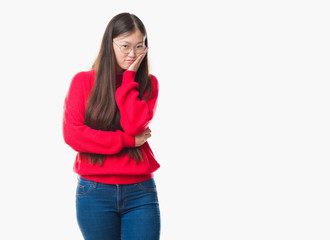 Young Chinese woman over isolated background wearing glasses thinking looking tired and bored with depression problems with crossed arms.