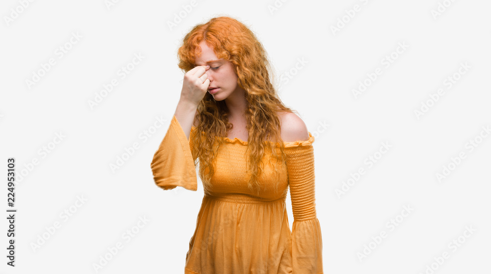 Wall mural young redhead woman tired rubbing nose and eyes feeling fatigue and headache. stress and frustration