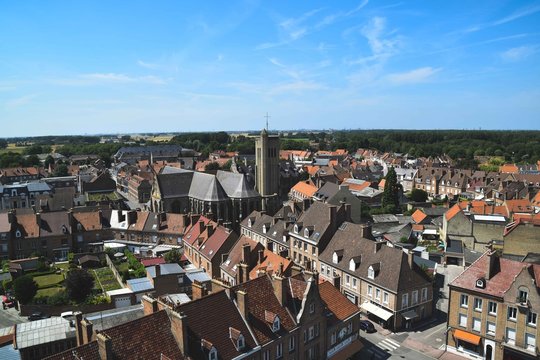 Aerial view of a Flemish Town with houses surrounding a church - Bergues, France