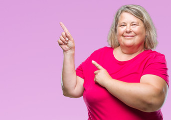 Senior plus size caucasian woman over isolated background smiling and looking at the camera pointing with two hands and fingers to the side.