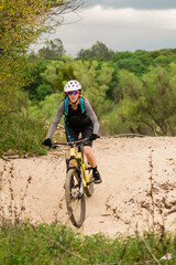 Fototapeta na wymiar Woman Mountain Biking Granite Bay