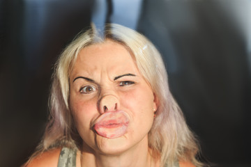 female face pressed against glass or window