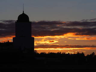 Silhouette Saint Olav tower, medieval Swedish fortress castle on the sunset background in Vyborg, Russia